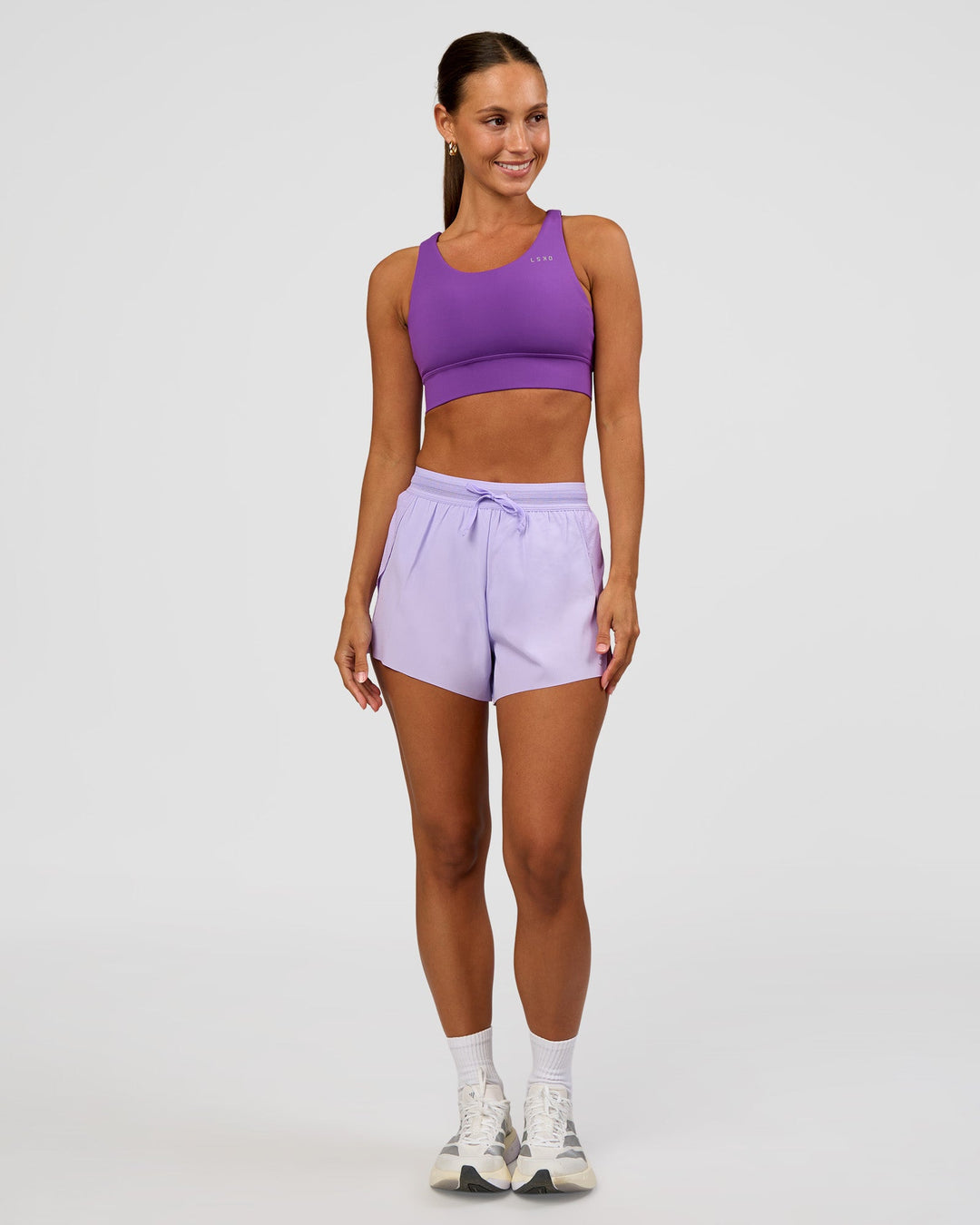 Woman wearing Accelerate 3" High-Rise Running Short - Pale Lilac | Model:Brylee | Size:XS