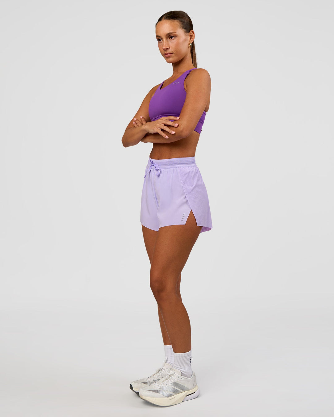 Woman wearing Accelerate 3" High-Rise Running Short - Pale Lilac | Model:Brylee | Size:XS