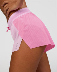 Woman wearing Accelerate 3" Mid-Rise Running Short - Candy Pink-Marshmallow | Model:Brylee | Size:XS