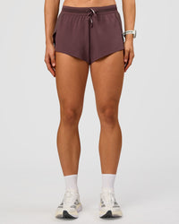 Woman wearing Accelerate 3" Mid-Rise Running Short - Cocoa Powder | Set:true | Angle:front | Model:Maja | Size:XS