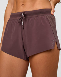 Woman wearing Accelerate 3" Mid-Rise Running Short - Cocoa Powder | Set:true | Angle:closeup | Model:Maja | Size:XS