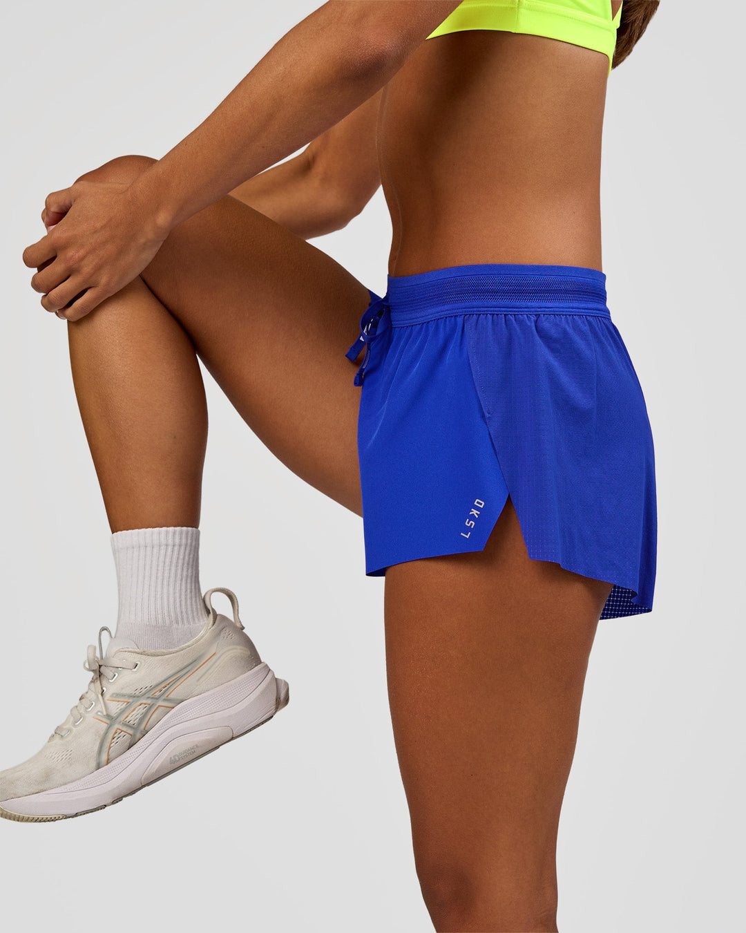 Woman wearing Accelerate 3" Mid-Rise Running Short - Electric Indigo | Model:Brylee | Size:XS