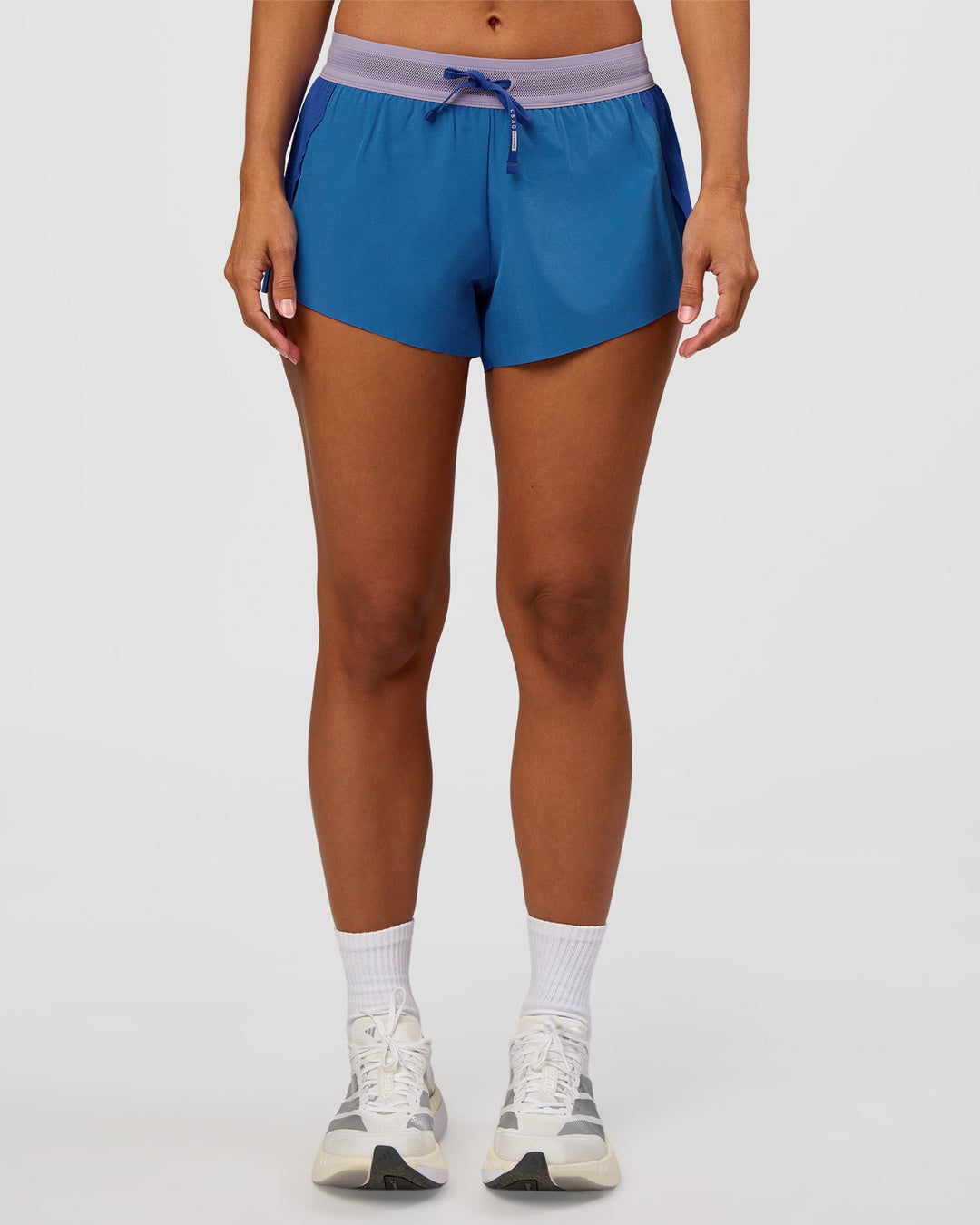 Woman wearing Accelerate 3" Mid-Rise Running Short - Electric Indigo-Multi | Set:true | Angle:front | Model:Brylee | Size:XS