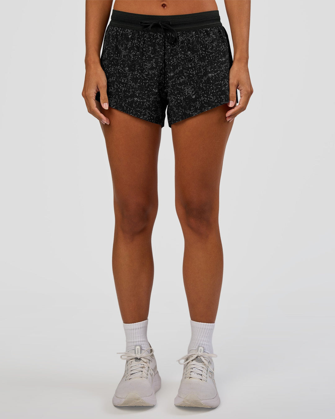 Woman wearing Accelerate 3" Mid-Rise Running Short - Energy Print Black | Set:true | Angle:front | Model:Brylee | Size:XS