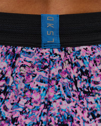 Woman wearing Accelerate 3" Mid-Rise Running Short in Energy Print Blue Multi | Model:Brylee | Size:XS