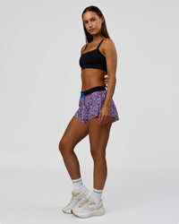Woman wearing Accelerate 3" Mid-Rise Running Short in Energy Print Blue Multi | Model:Brylee | Size:XS