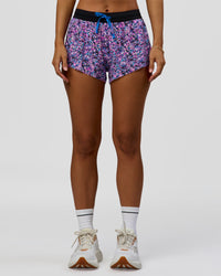 Woman wearing Accelerate 3" Mid-Rise Running Short in Energy Print Blue Multi | Model:Brylee | Size:XS