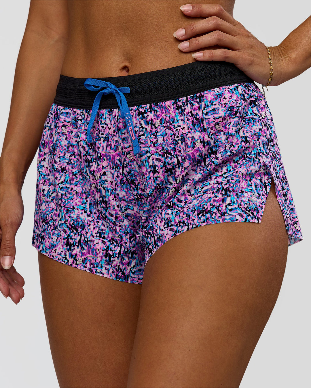 Woman wearing Accelerate 3" Mid-Rise Running Short in Energy Print Blue Multi | Model:Brylee | Size:XS
