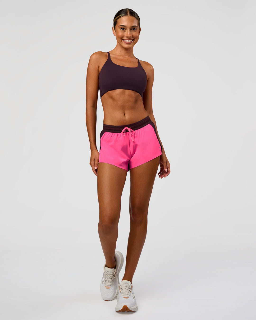Woman wearing Accelerate 3" Mid-Rise Running Short - Midnight Plum-Sugar Plum | Model:Charli | Size:XS - view 3