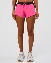 Woman wearing Accelerate 3" Mid-Rise Running Short - Midnight Plum-Sugar Plum | Set:True | Angle:front | Model:Charli | Size:XS | Thumbnail Index: 5