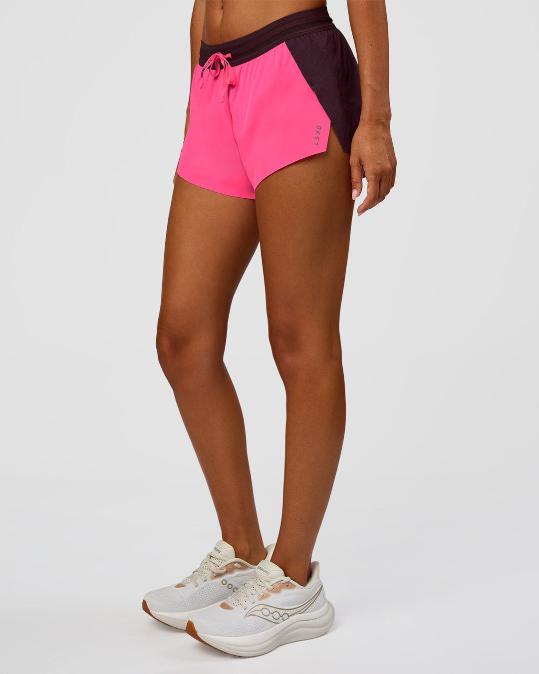 Woman wearing Accelerate 3" Mid-Rise Running Short - Midnight Plum-Sugar Plum | Set:True | Angle:side | Model:Charli | Size:XS - view 2