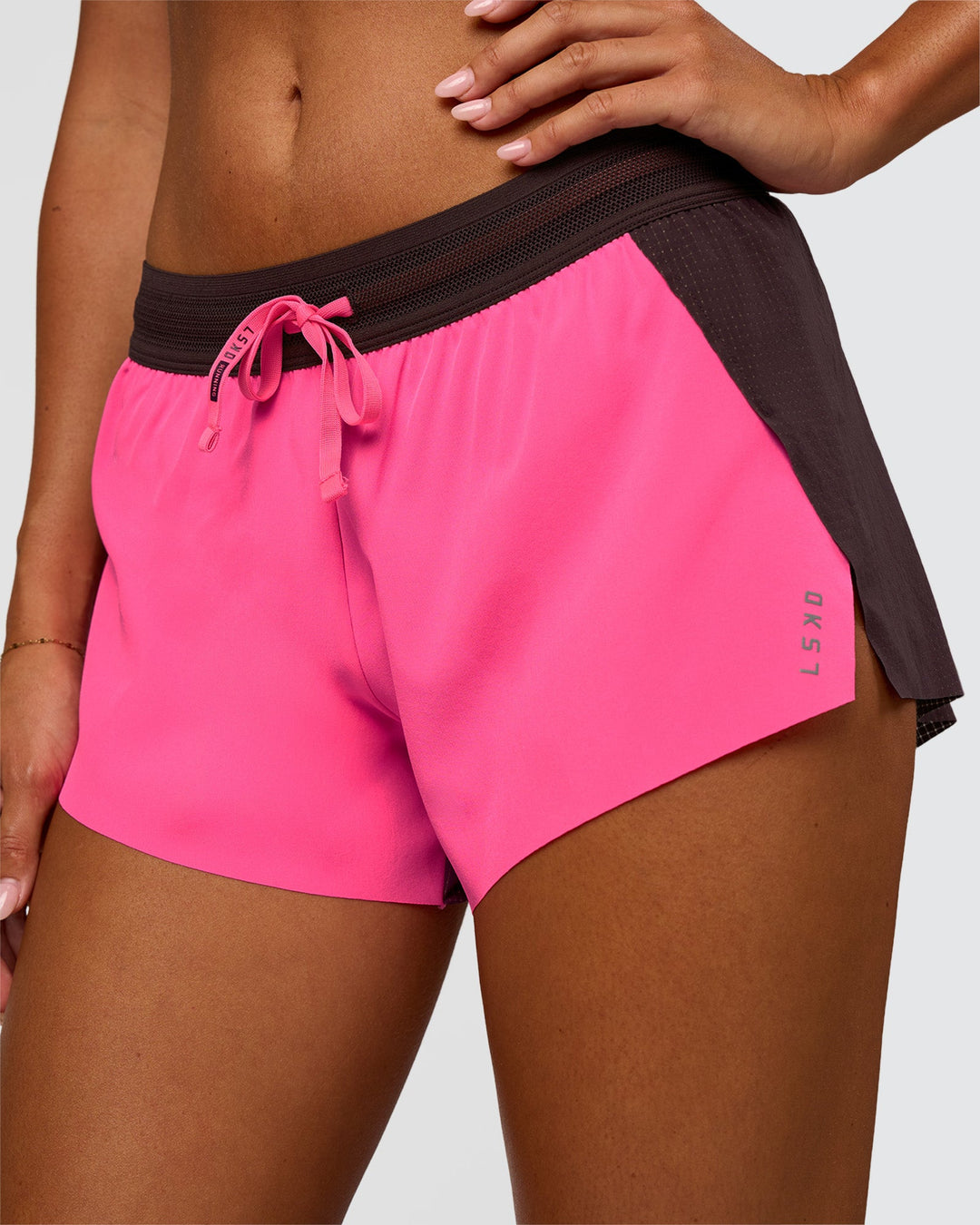 Woman wearing Accelerate 3" Mid-Rise Running Short - Midnight Plum-Sugar Plum | Set:True | Angle:closeup | Model:Charli | Size:XS - view 1