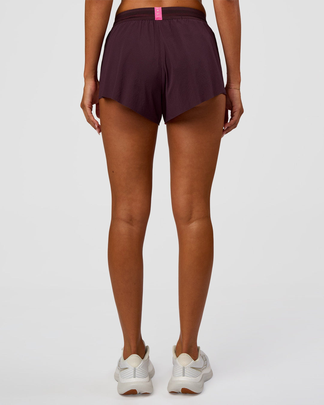 Woman wearing Accelerate 3" Mid-Rise Running Short - Midnight Plum-Sugar Plum | Set:True | Angle:back | Model:Charli | Size:XS - view 4