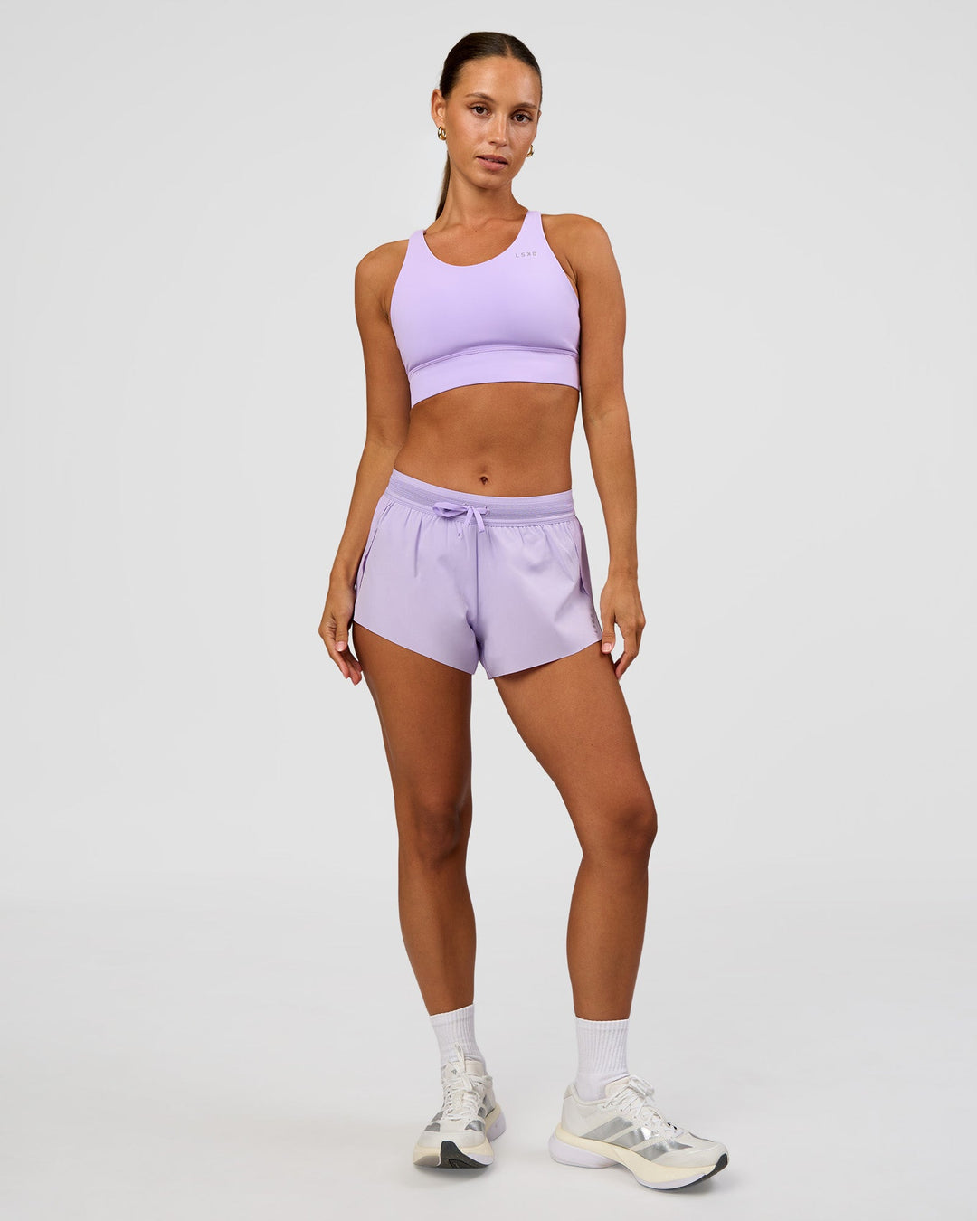 Woman wearing Accelerate 3" Mid-Rise Running Short - Pale Lilac | Model:Brylee | Size:XS