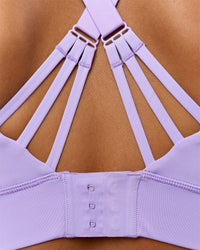 Woman wearing Accelerate Split Strap Sports Bra - Pale Lilac | Model:Brylee | Size:XS