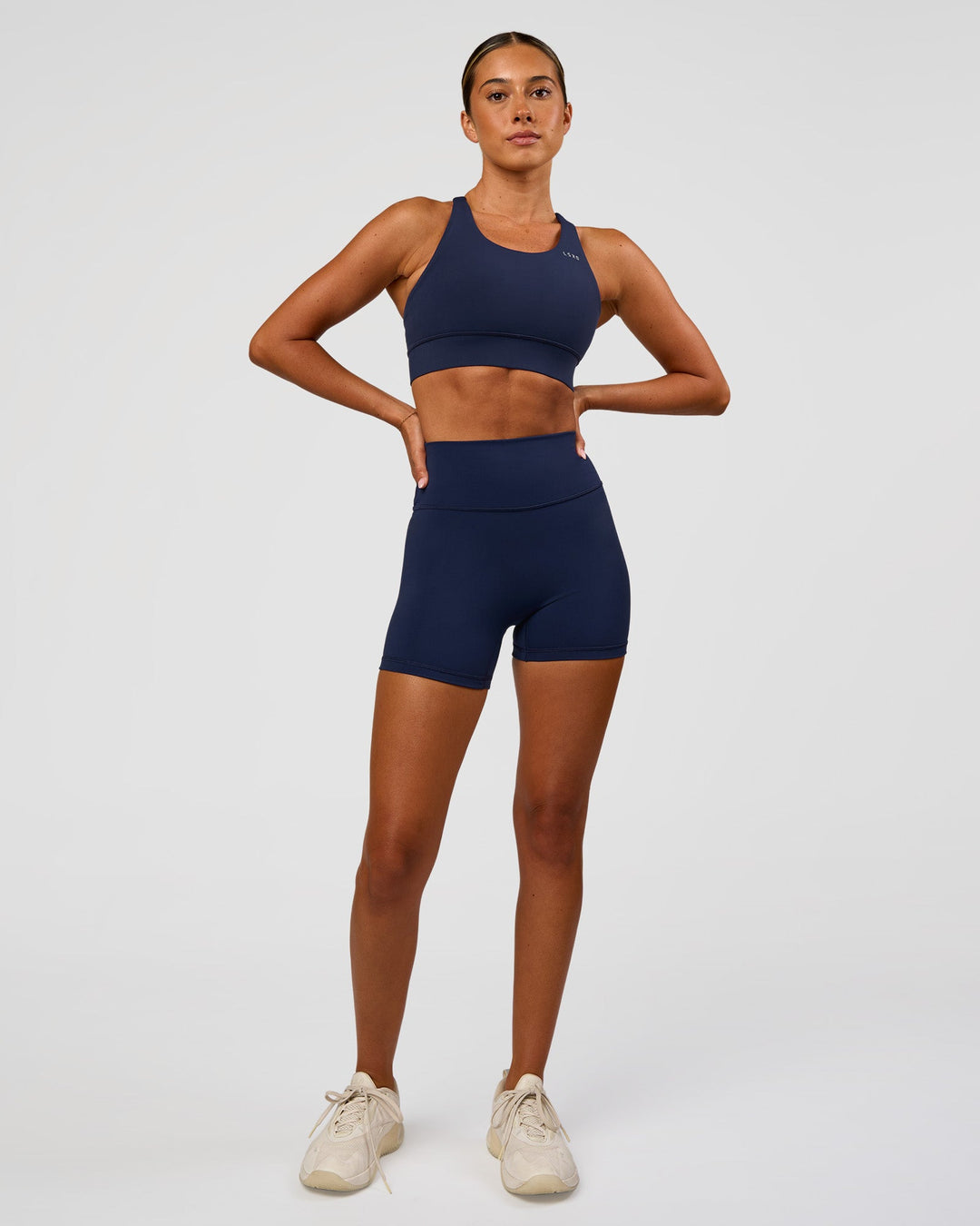 Woman wearing Accelerate Sports Bra - Future Navy | Model:Charlie | Size:XS