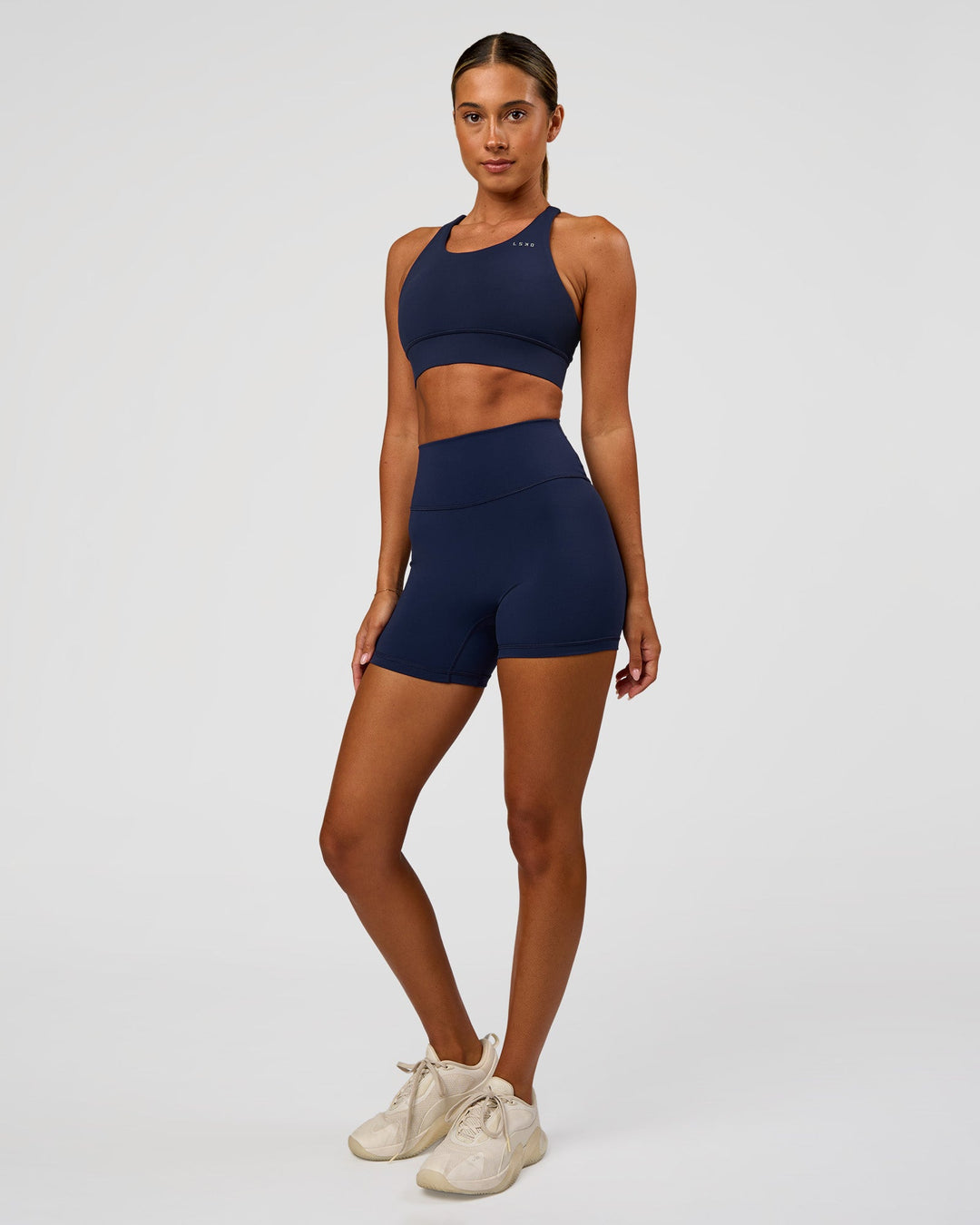 Woman wearing Accelerate Sports Bra - Future Navy | Model:Charlie | Size:XS - view 4