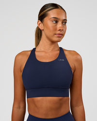 Woman wearing Accelerate Sports Bra - Future Navy | Model:Charlie | Size:XS | Thumbnail Index: 4