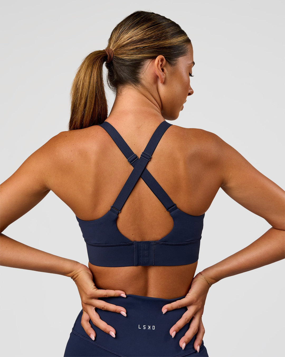 Woman wearing Accelerate Sports Bra - Future Navy | Model:Charlie | Size:XS - view 2