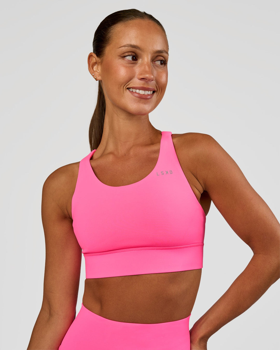 Woman wearing Accelerate Sports Bra - Sugar Plum | Set:true | Angle:front | Model:Brylee | Size:XS - view 2