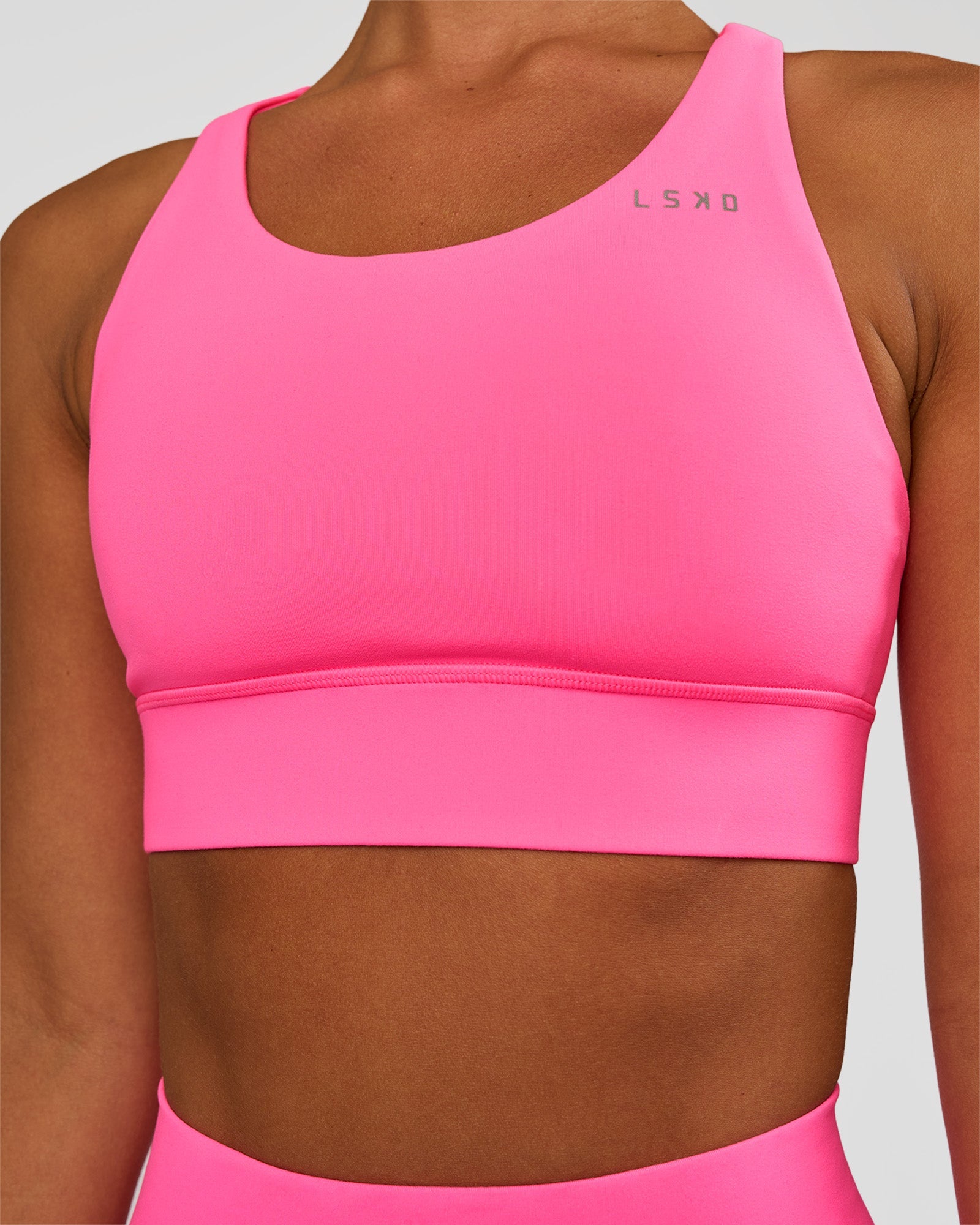 Woman wearing Accelerate Sports Bra - Sugar Plum | Set:true | Angle:closeup | Model:Brylee | Size:XS