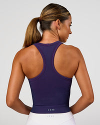 Woman wearing Activate Seamless Ribbed Shelf Bra Tank - Future Navy-Ultra Fuchsia | Model:Charli | Size:XS