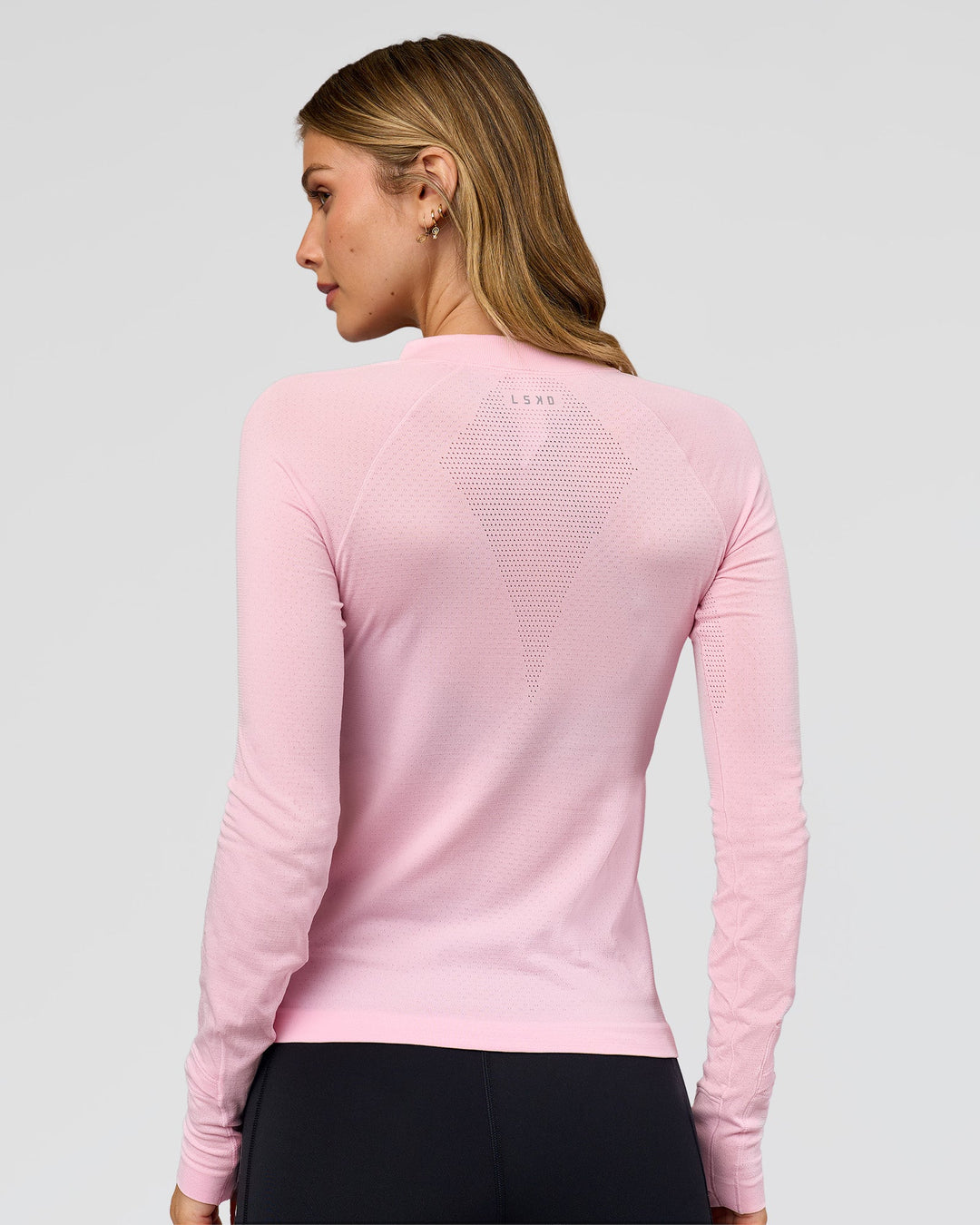 Woman wearing AeroFLX+ Long Sleeve Half Zip - Marshmallow/Marshmallow | Model:Leilani | Size:XS