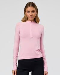 Woman wearing AeroFLX+ Long Sleeve Half Zip - Marshmallow/Marshmallow | Model:Leilani | Size:XS