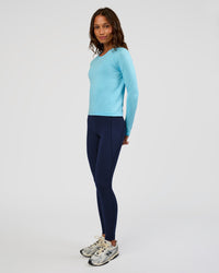 Woman wearing AeroFLX+ Seamless Long Sleeve Tee - Baltic Sea/Baltic Sea | Model:Dakota | Size:XS