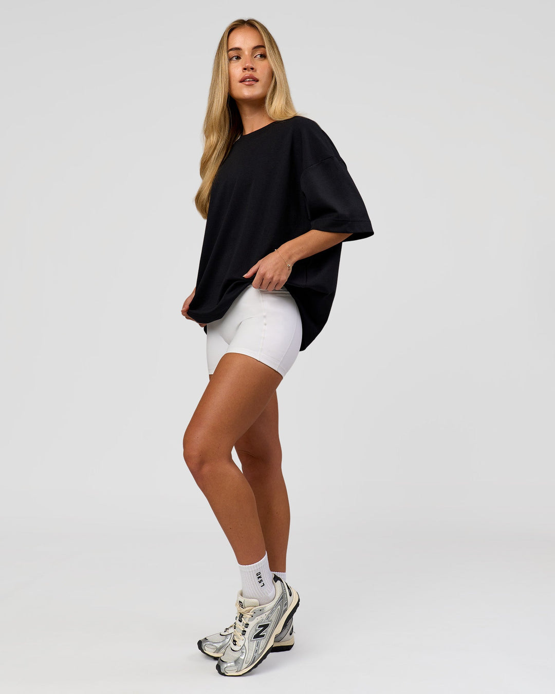 Woman wearing AfterDark ZeroCrease Boxy Tee in Black | Model:Issy | Size:XS