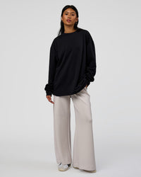 Woman wearing AfterDark ZeroCrease Long Sleeve Tee - Black | Model:Loren | Size:XS