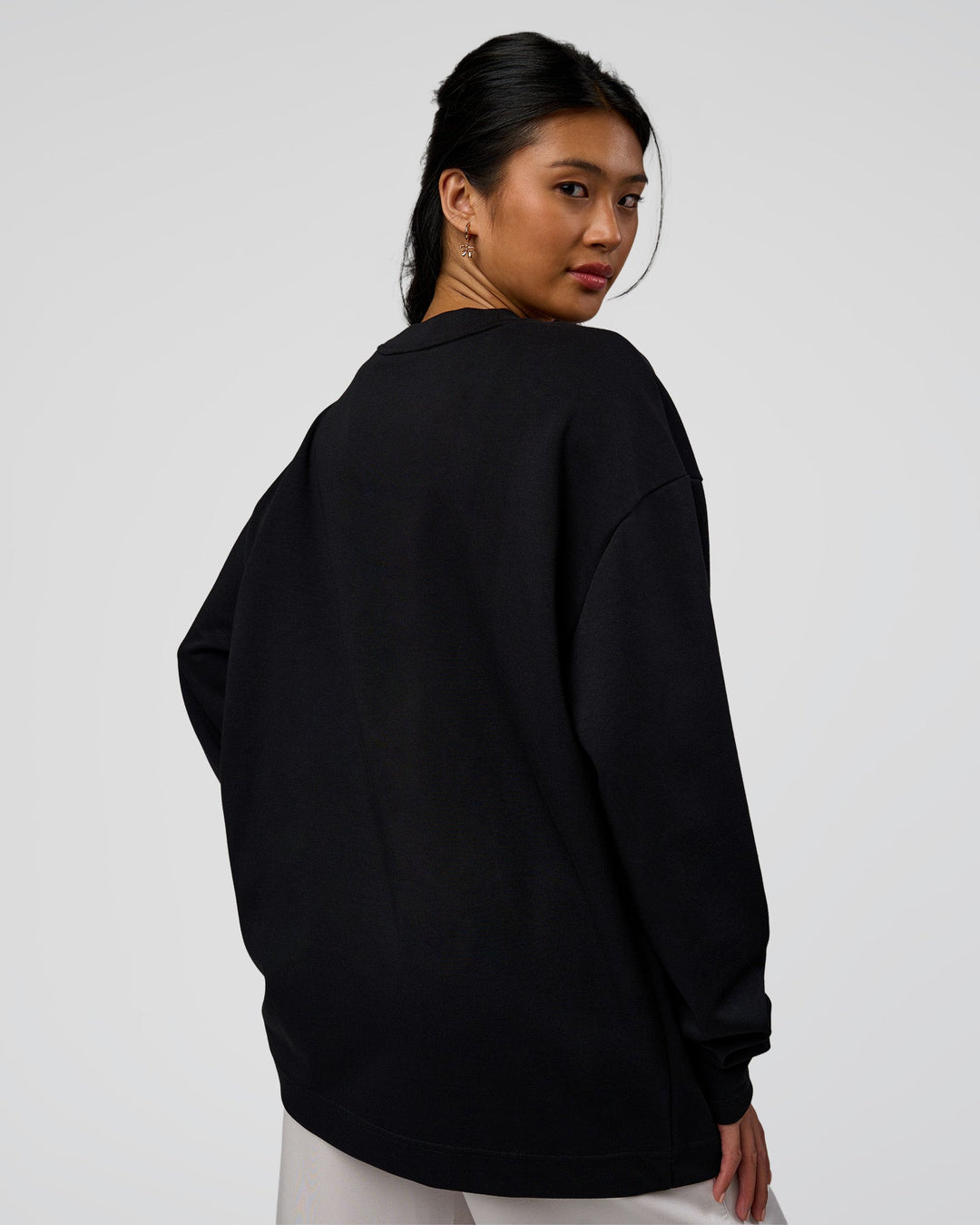 Woman wearing AfterDark ZeroCrease Long Sleeve Tee - Black | Model:Loren | Size:XS