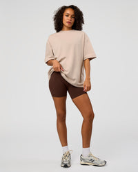 Woman wearing AfterDark ZeroCrease Oversized Tee - Shale Beige | Model:Jasmine | Size:XS