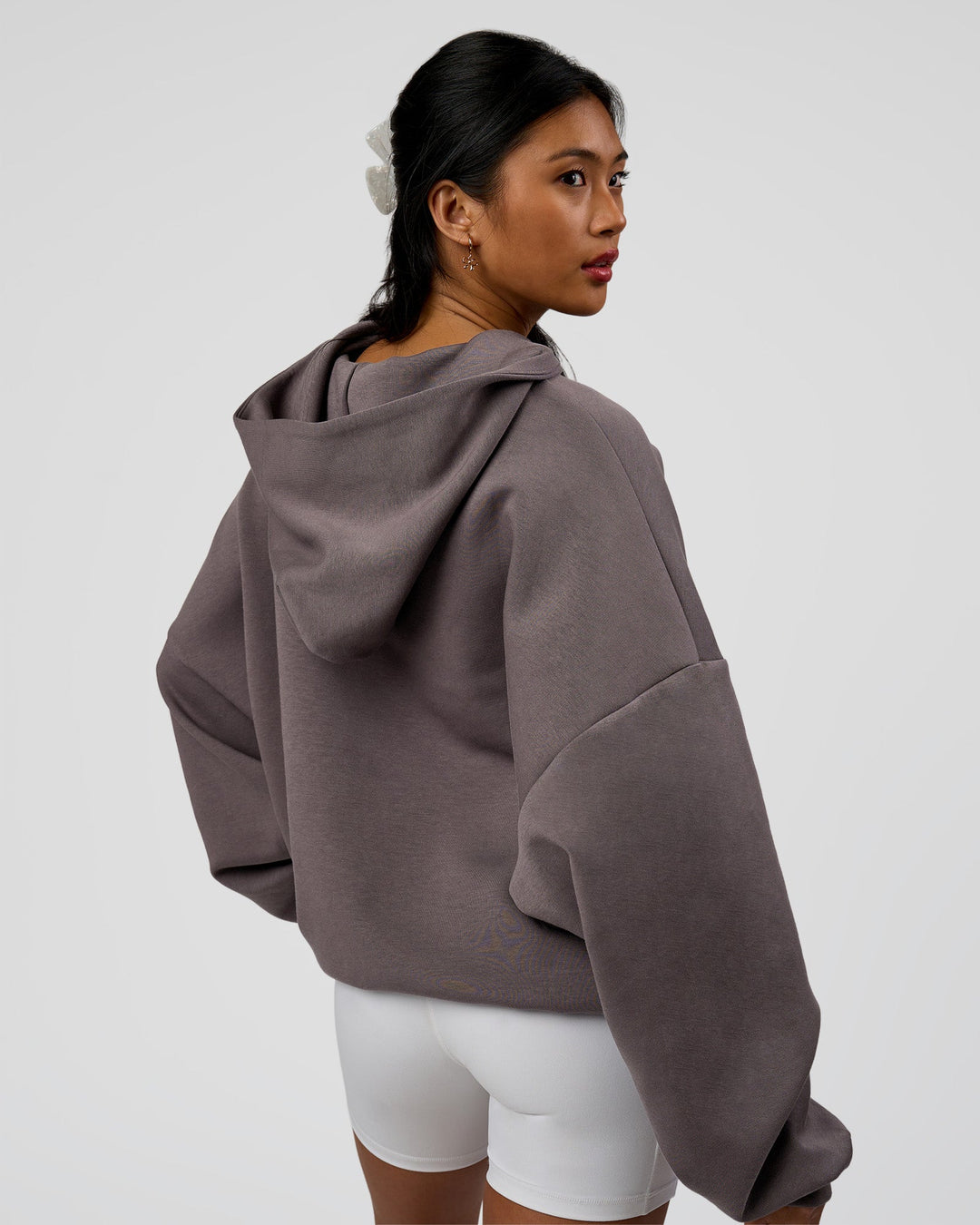 Woman wearing AfterDark ZeroCrease Oversized Hoodie - Duskstone | Model:Loren | Size:XS