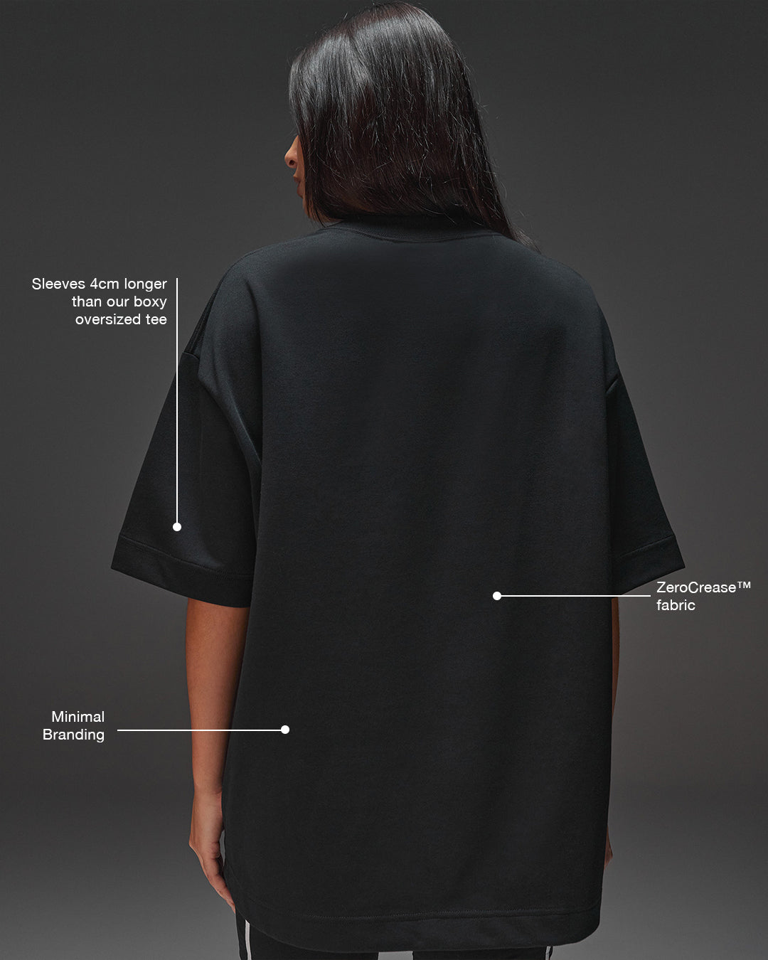 Woman wearing AfterDark ZeroCrease Oversized Tee - Black | Model:Ruby | Size:XS