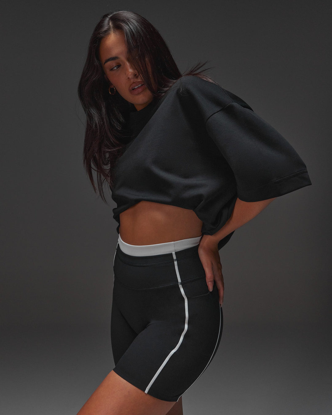 Woman wearing AfterDark ZeroCrease Oversized Tee - Black | Model:Ruby | Size:XS