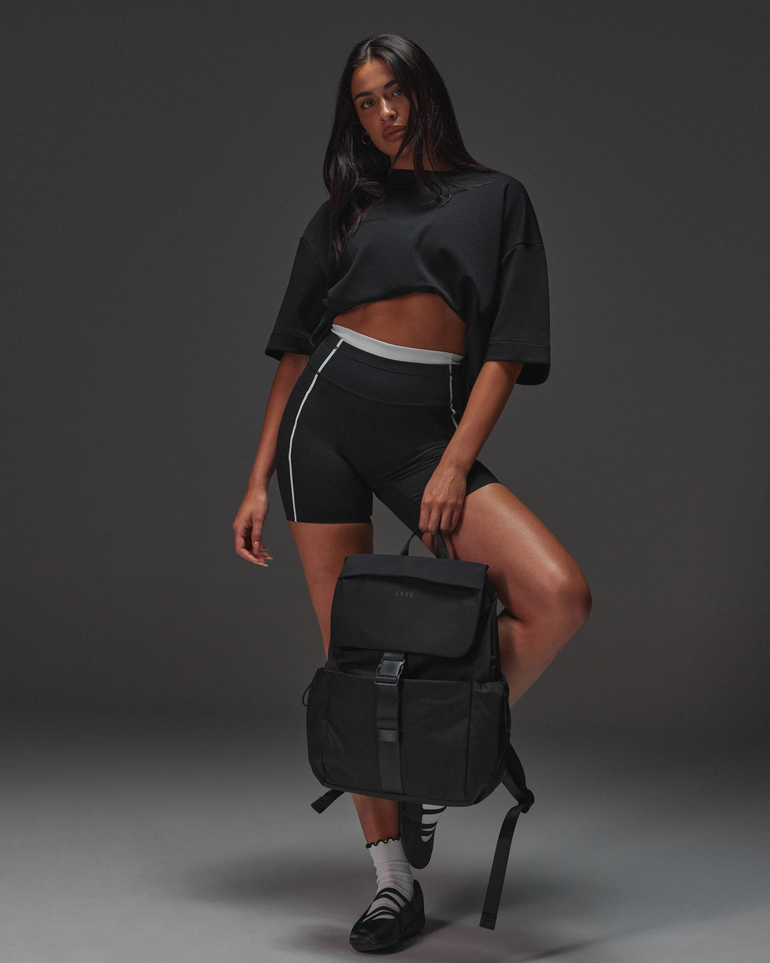 Woman wearing AfterDark ZeroCrease Oversized Tee - Black | Model:Ruby | Size:XS