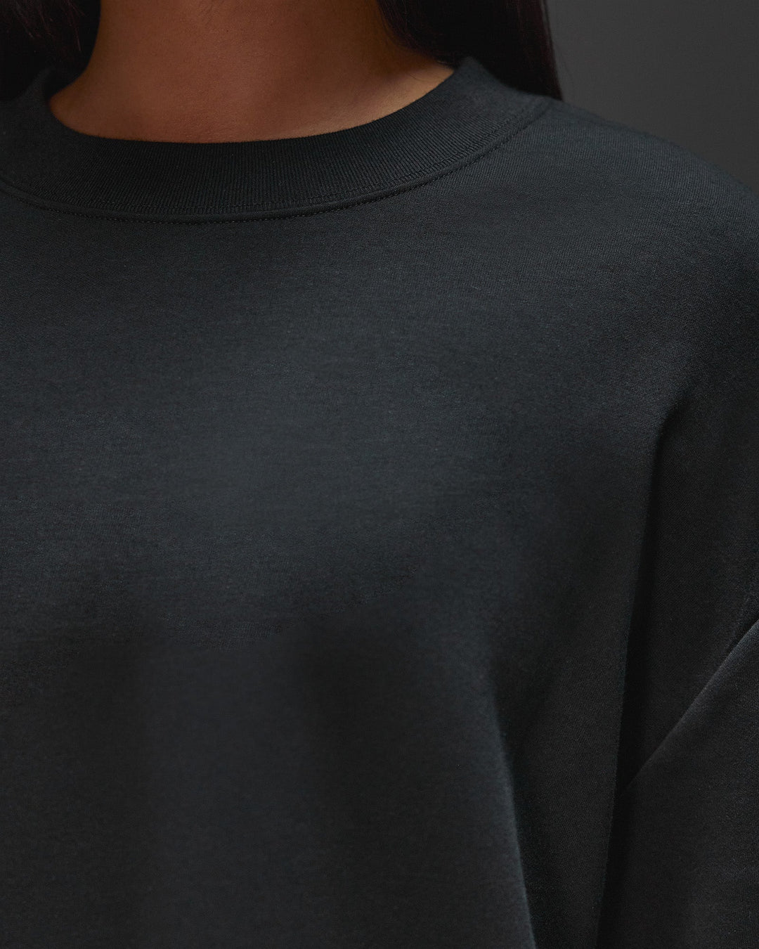 Woman wearing AfterDark ZeroCrease Oversized Tee - Black | Model:Ruby | Size:XS