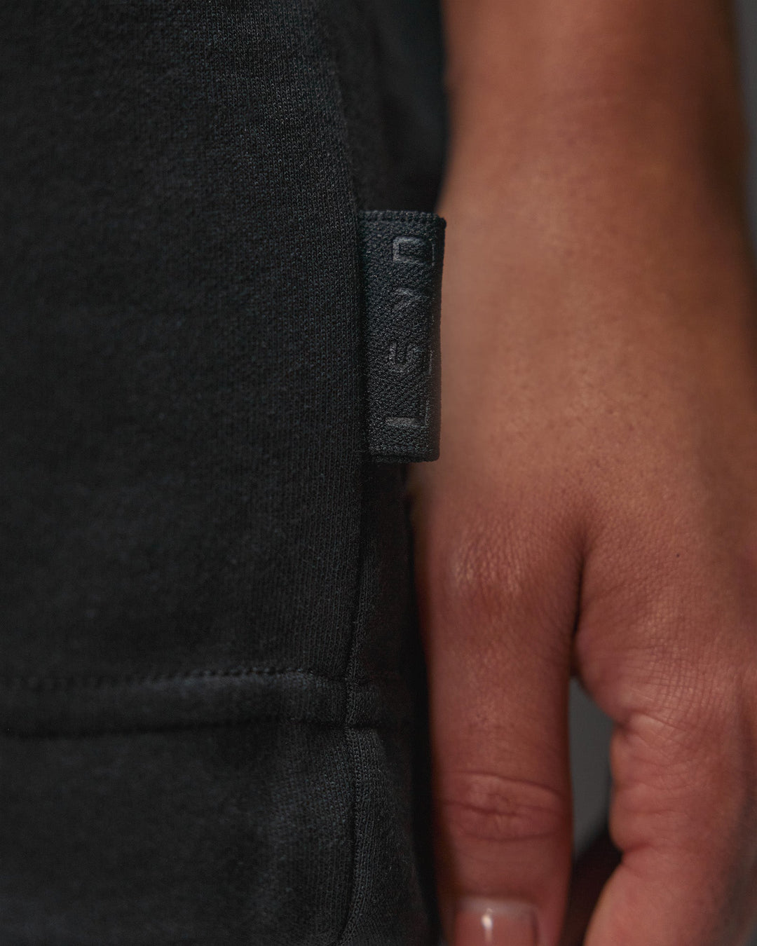 Woman wearing AfterDark ZeroCrease Oversized Tee - Black | Model:Ruby | Size:XS