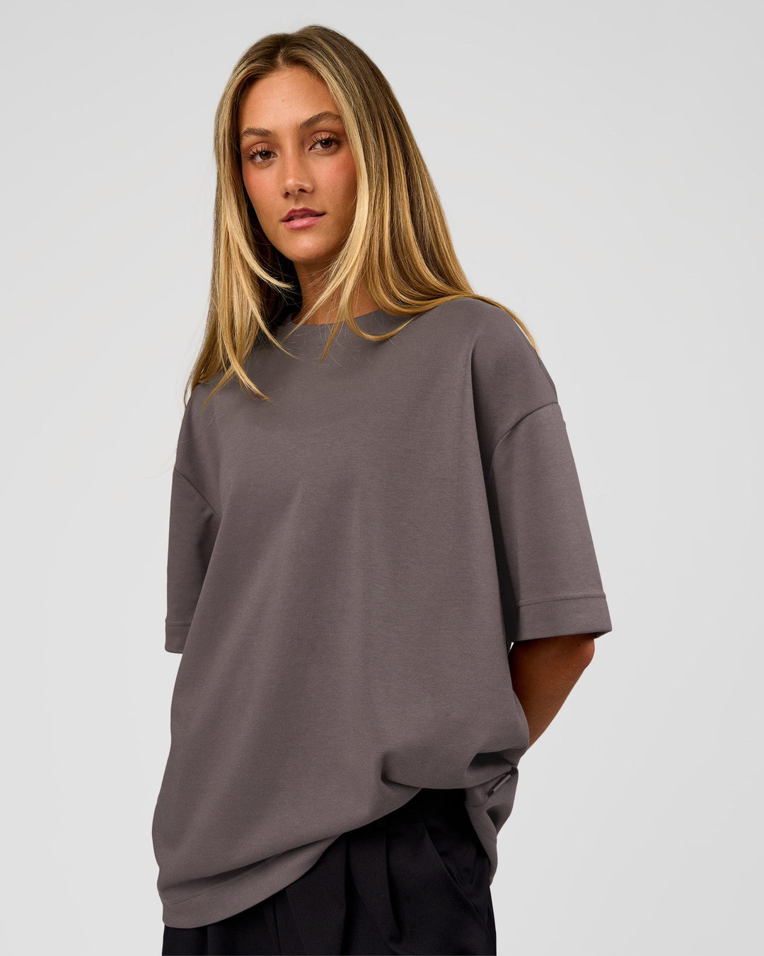 Woman wearing AfterDark ZeroCrease Oversized Tee - Duskstone | Model:Georgia | Size:XS