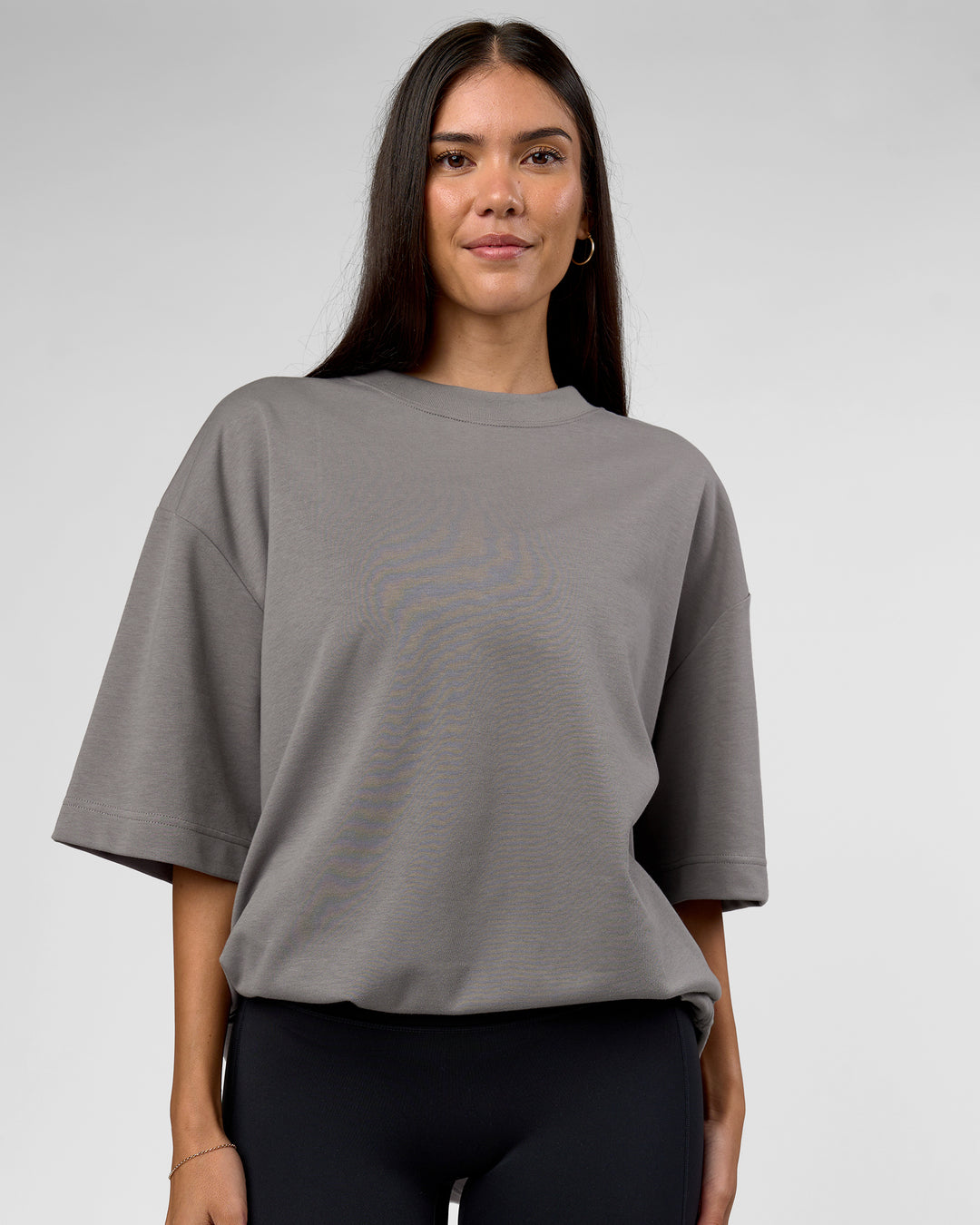 Woman wearing AfterDark ZeroCrease Oversized Tee - Storm Front | Model:Rhylee | Size:XS