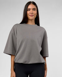 Woman wearing AfterDark ZeroCrease Oversized Tee - Storm Front | Model:Rhylee | Size:XS