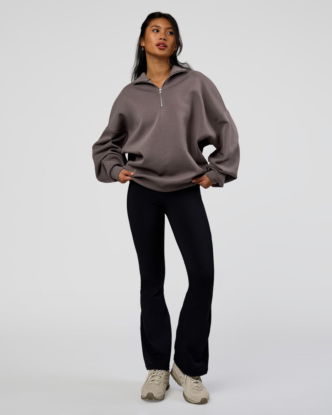 Woman wearing AfterDark ZeroCrease Quarter Zip - Duskstone | Model:Loren | Size:XS