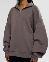 Woman wearing AfterDark ZeroCrease Quarter Zip - Duskstone | Model:Loren | Size:XS