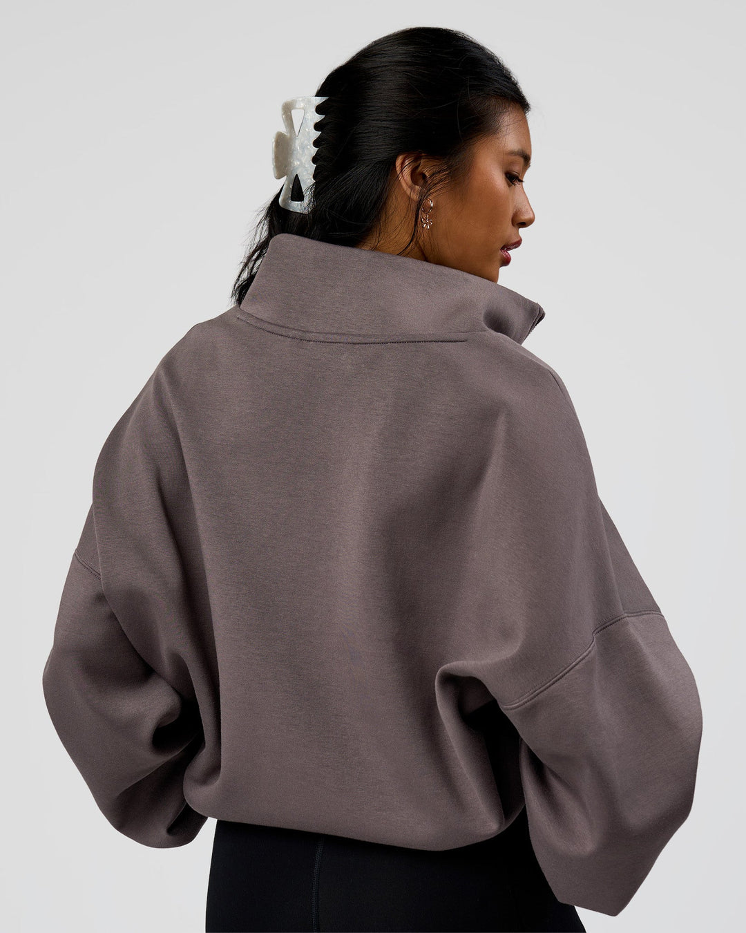 Woman wearing AfterDark ZeroCrease Quarter Zip - Duskstone | Model:Loren | Size:XS