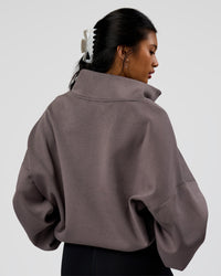 Woman wearing AfterDark ZeroCrease Quarter Zip - Duskstone | Model:Loren | Size:XS