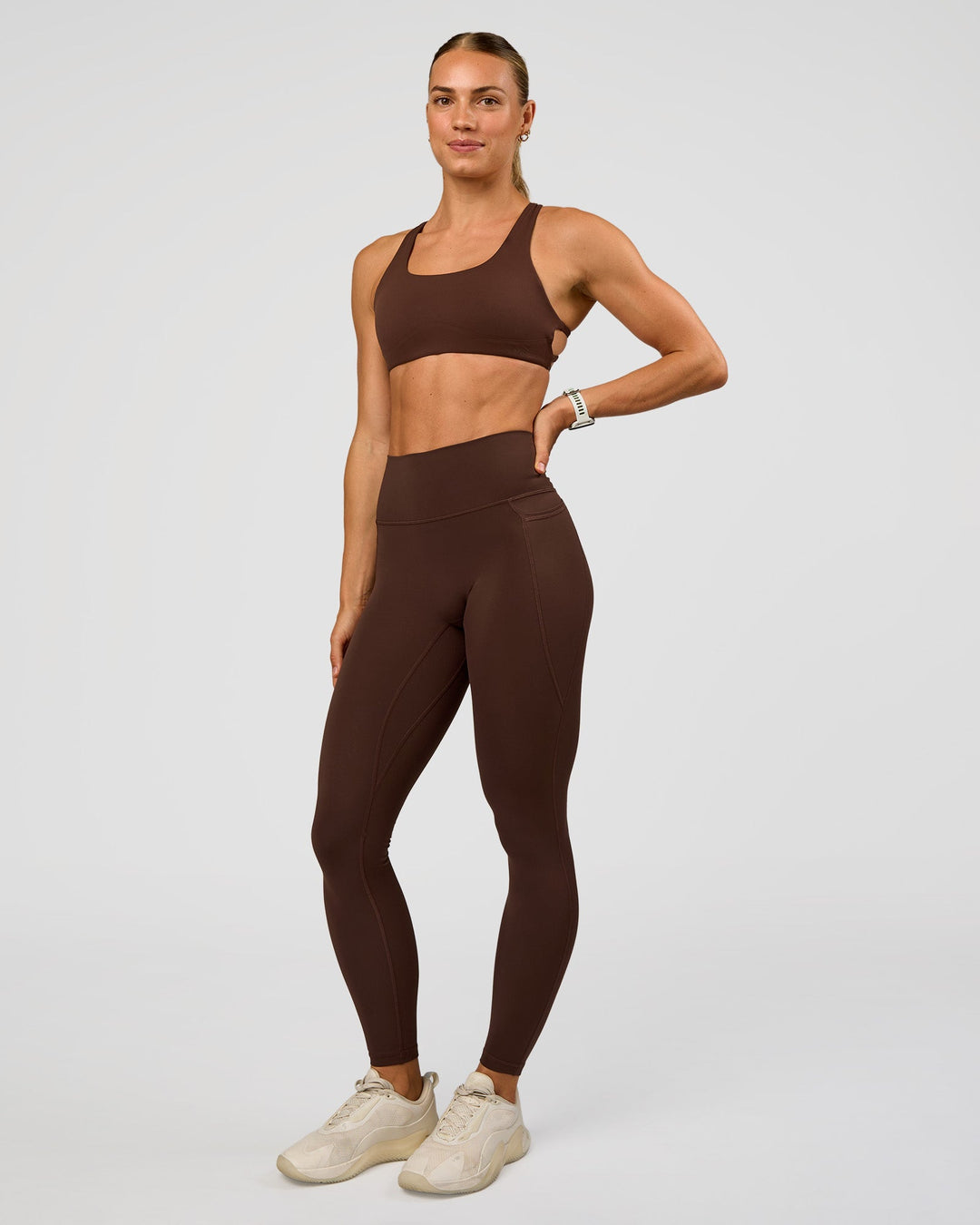 Woman wearing Aspire Sports Bra - Hot Chocolate | Model:Maja | Size:XS