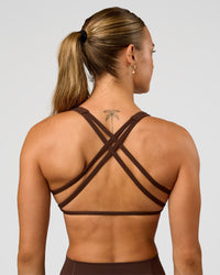 Woman wearing Aspire Sports Bra - Hot Chocolate | Model:Maja | Size:XS