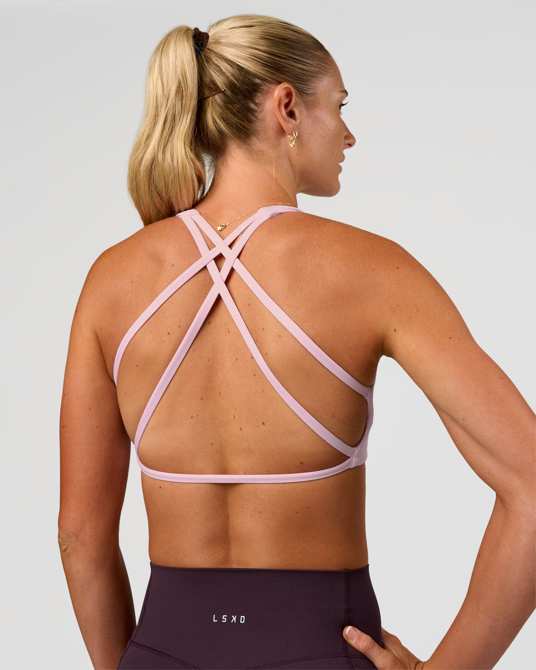 Woman wearing Aspire Sports Bra - Marshmallow | Model:Emelia | Size:XS