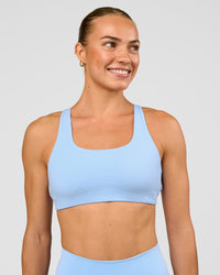 Woman wearing Aspire Sports Bra - Open Air | Model:Maja | Size:XS